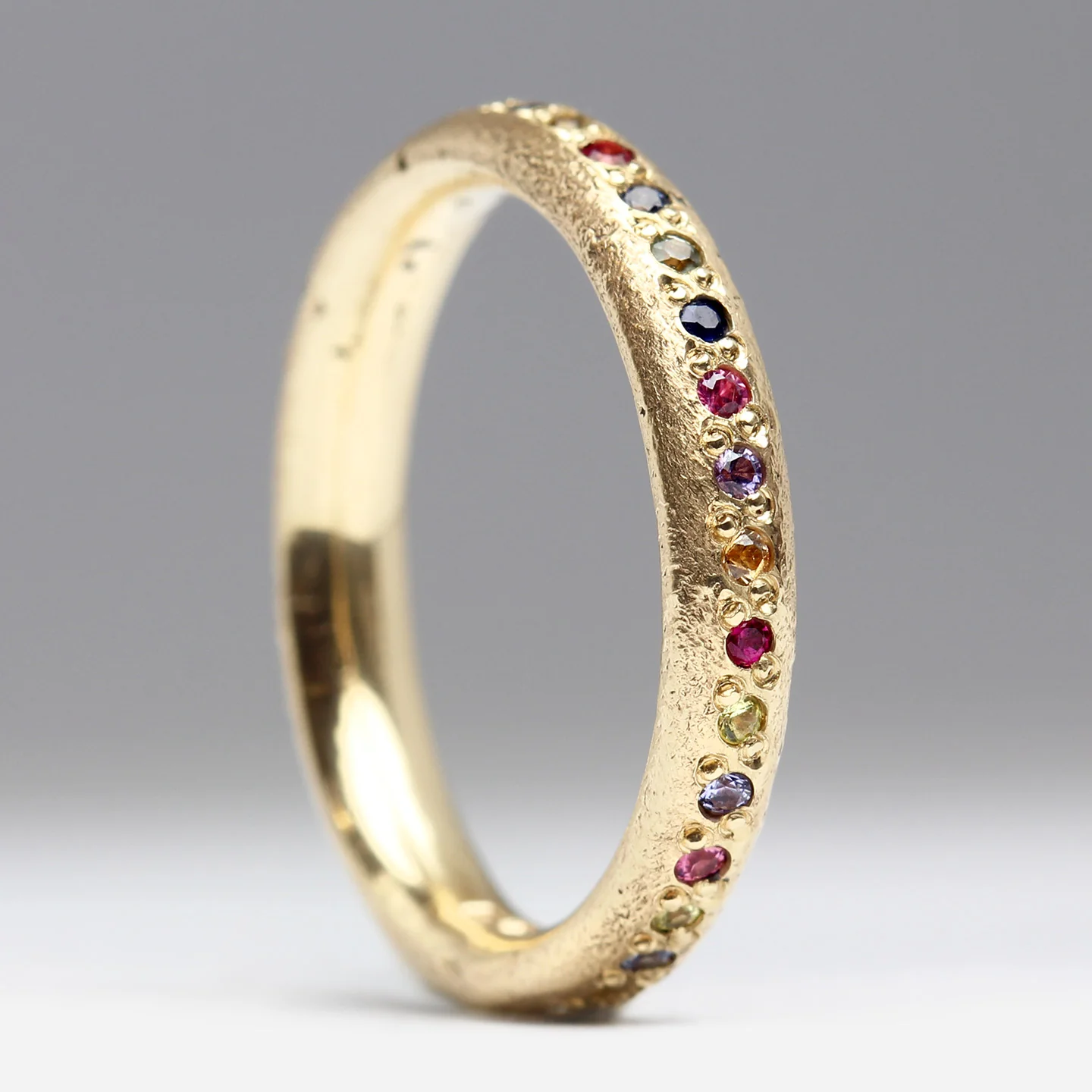 Sandcast Gold Rainbow Eternity Ring - Image 5