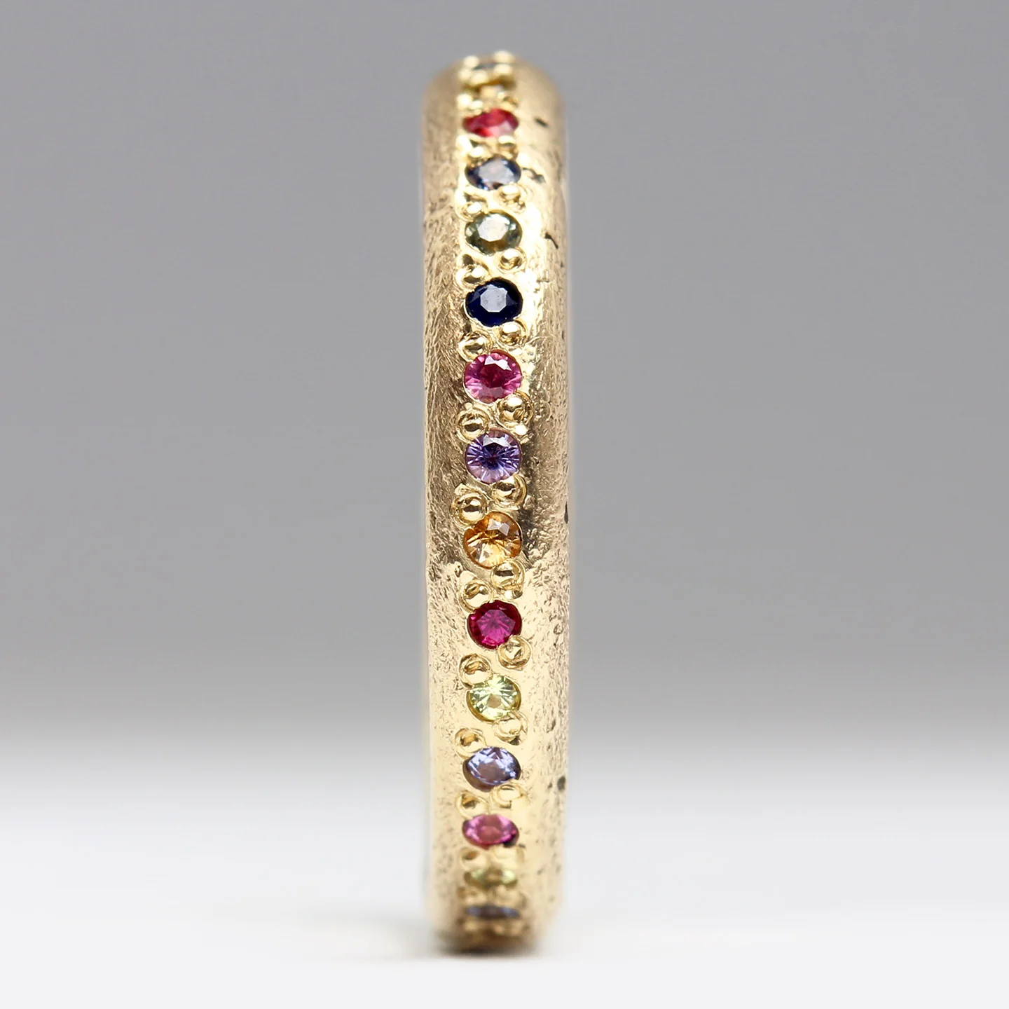 Sandcast Gold Rainbow Eternity Ring - Image 6