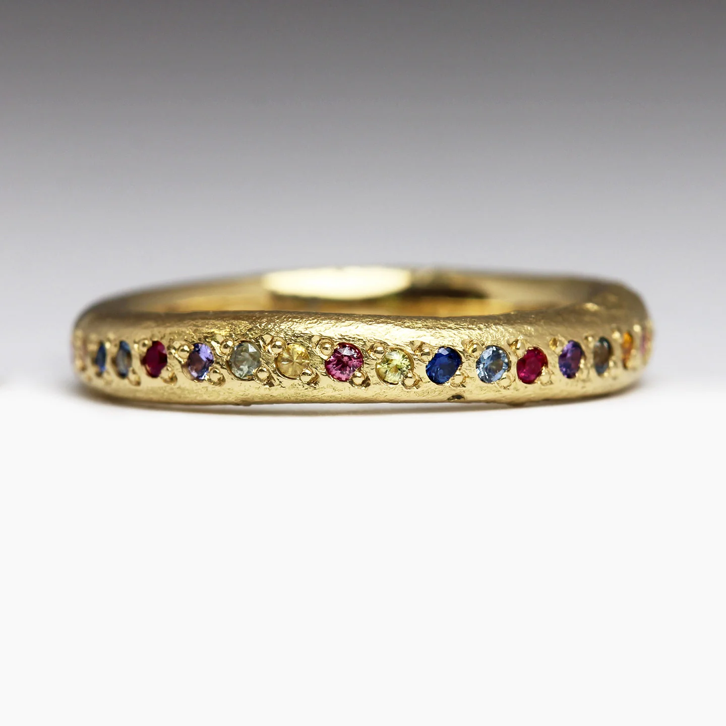 Sandcast Gold Rainbow Eternity Ring - Image 8